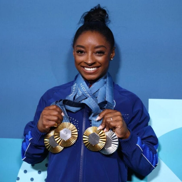 Simone Biles: A Proud Three-Time Olympian and Inspirational Gymnast