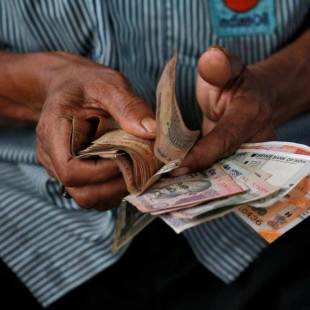 Indian Rupee Gains Amid Dollar Sales, Outlook Cautious
