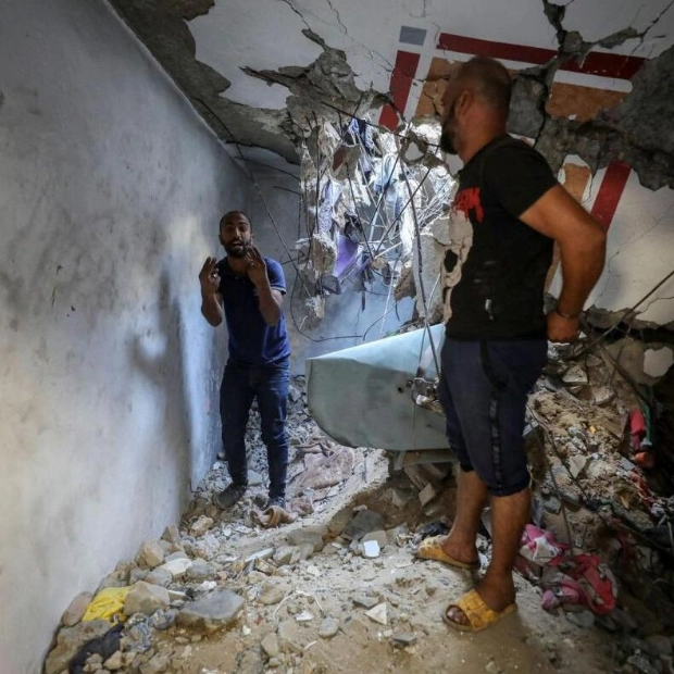 Israeli Strike on Gaza School Shelter Kills 14