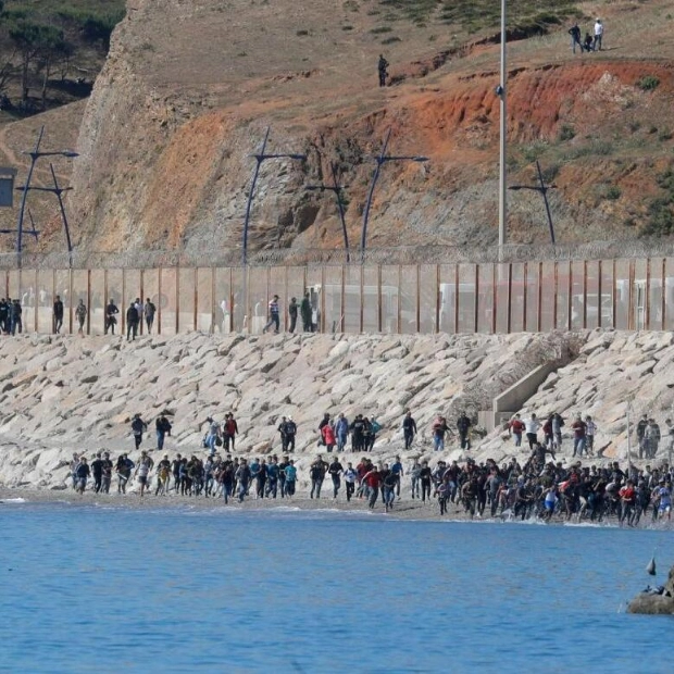 Migrants Take Advantage of Mist to Swim to Spanish Enclave of Ceuta