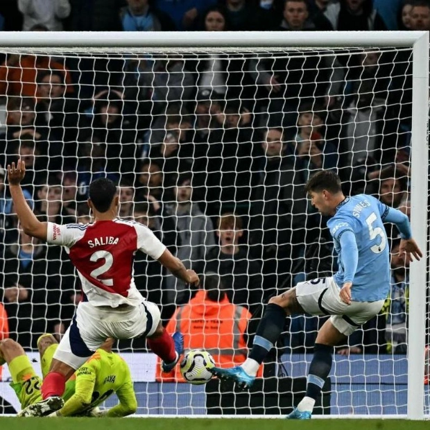 Stones' Late Goal Secures Draw for Man City Against Arsenal