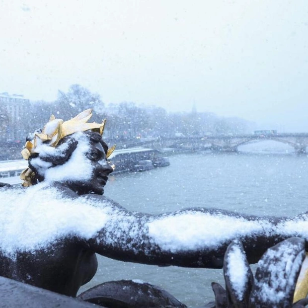 Paris Snowstorm: Alexandre III Bridge Statue in Heavy Snowfall