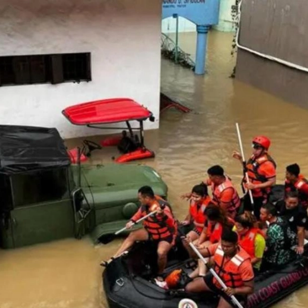 Philippines Rescuers Scramble to Aid Stranded Residents Amid Trami Floods