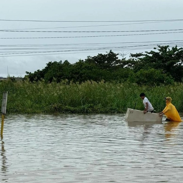 Rescuers Battle Floodwaters Amid Tropical Storm Trami