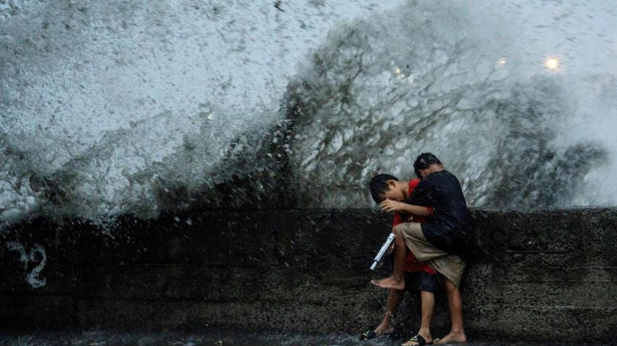 Children Play Near Pasig River Amid Super Typhoon Man-Yi