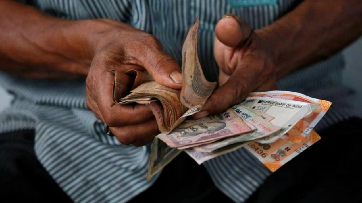 Indian Rupee Gains Amid Dollar Sales, Outlook Cautious