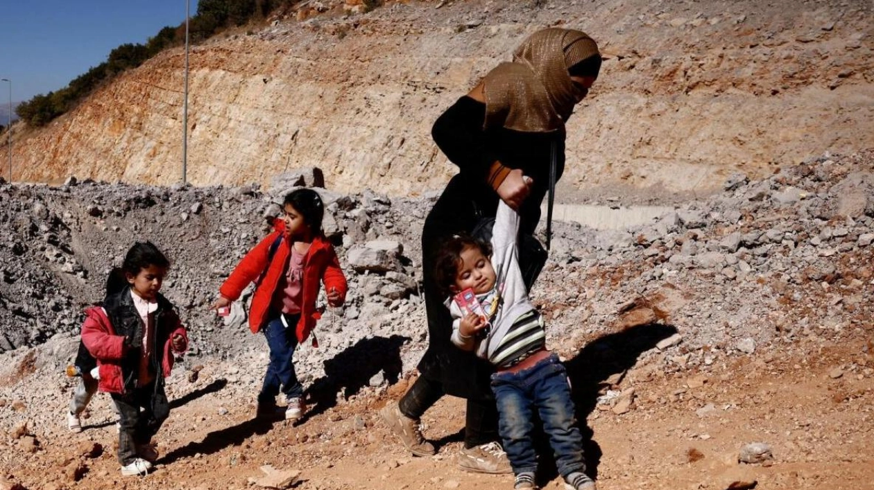 Fleeing Hostilities: A Woman Crosses from Lebanon to Syria