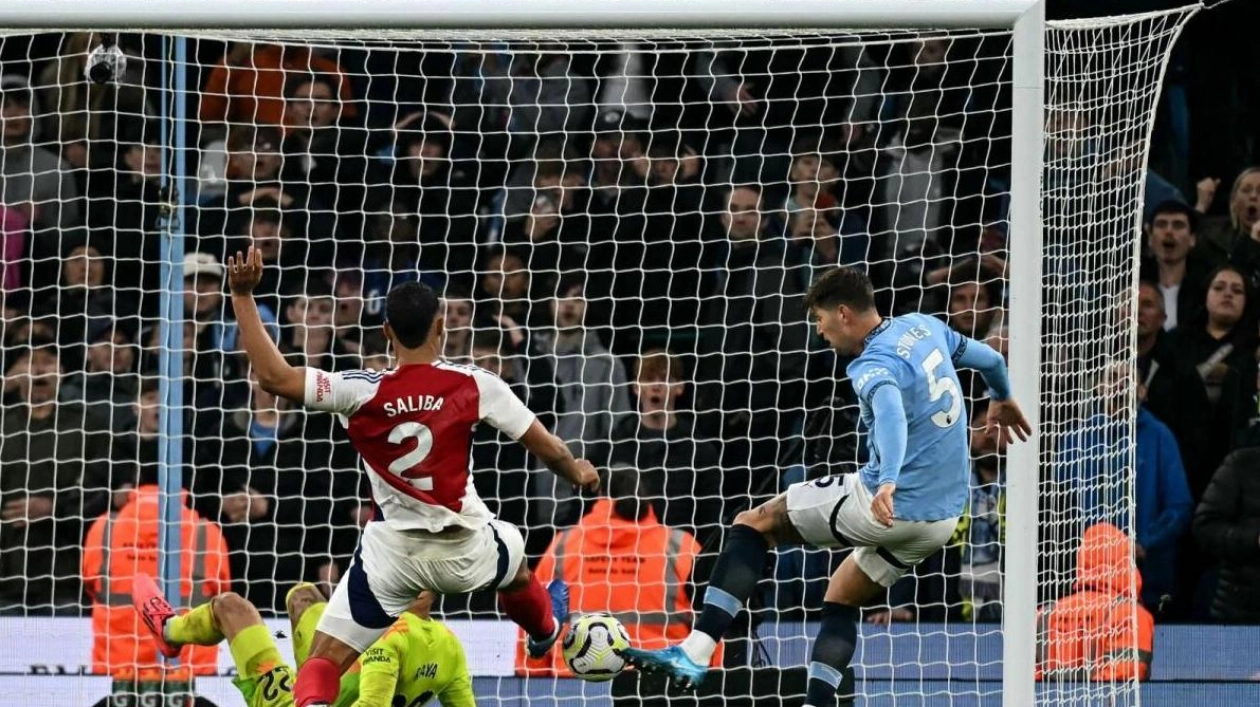 Stones' Late Goal Secures Draw for Man City Against Arsenal