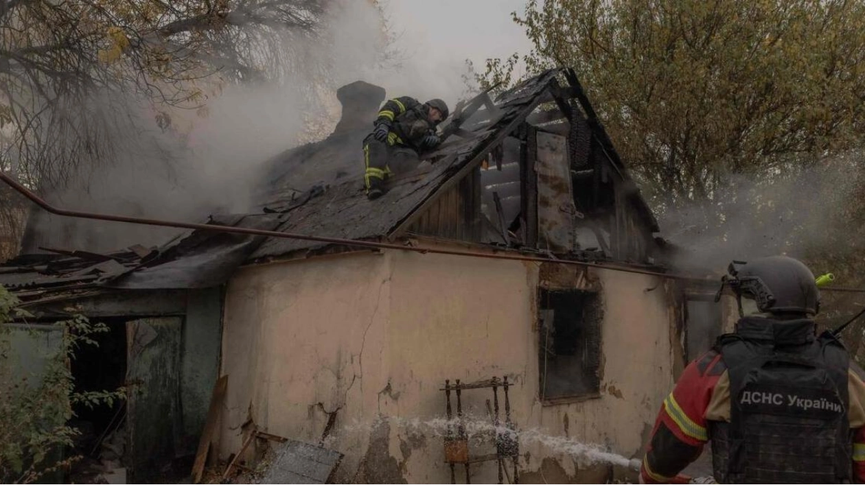 Ukrainian Firefighters Battle House Fire After Air Attack