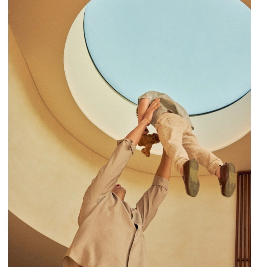 a man holding his son high
