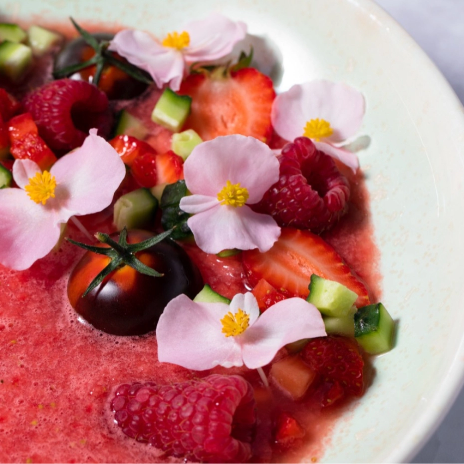 English strawberry soup with flowers on top