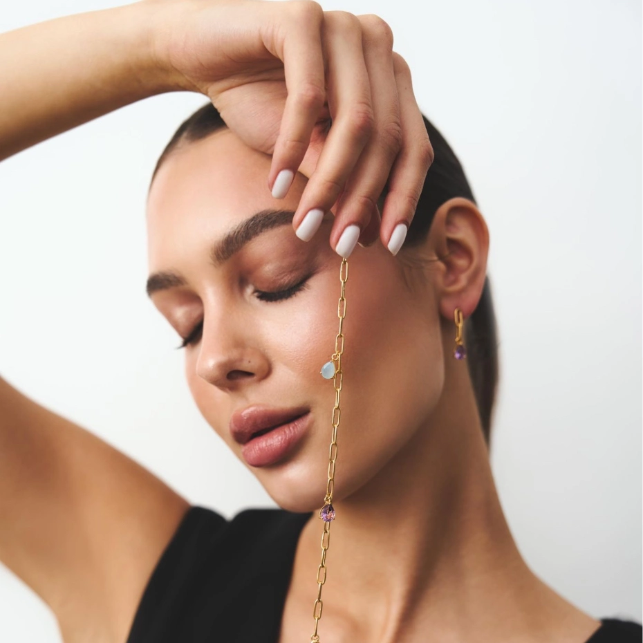 A woman holding a bracelet