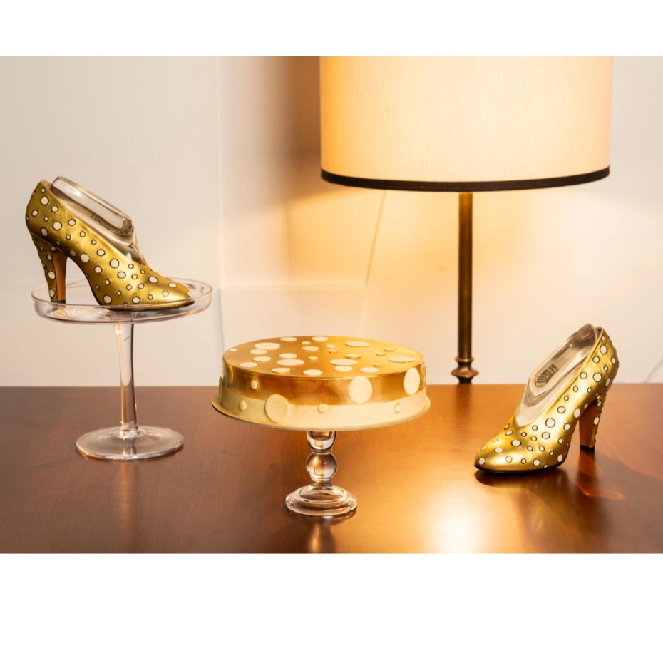 Golden tart in the shape of women's shoes