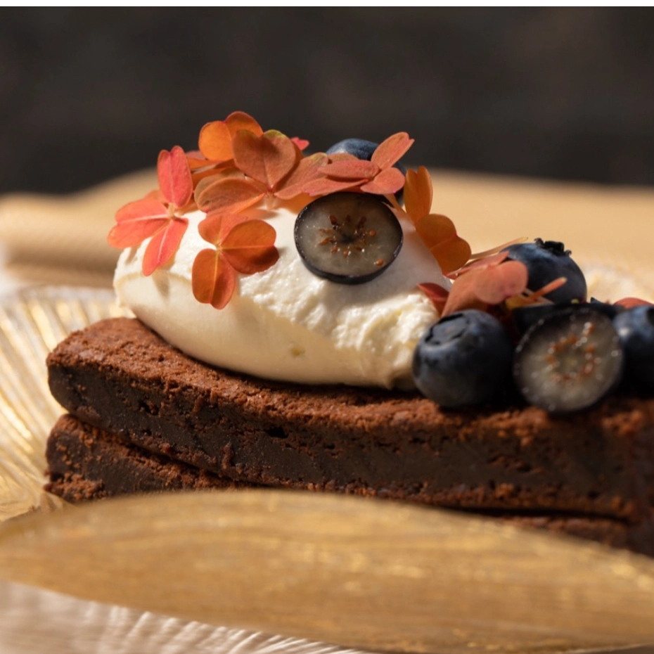 chocolate cake with ice-cream and flowers on top