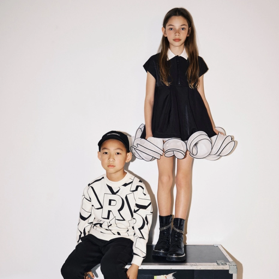 boy sitting and a girl standing