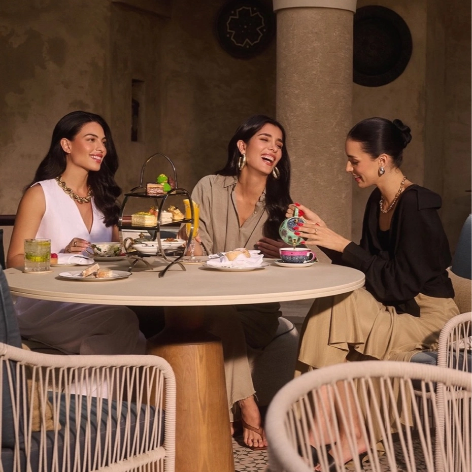 three ladies having tea and cakes